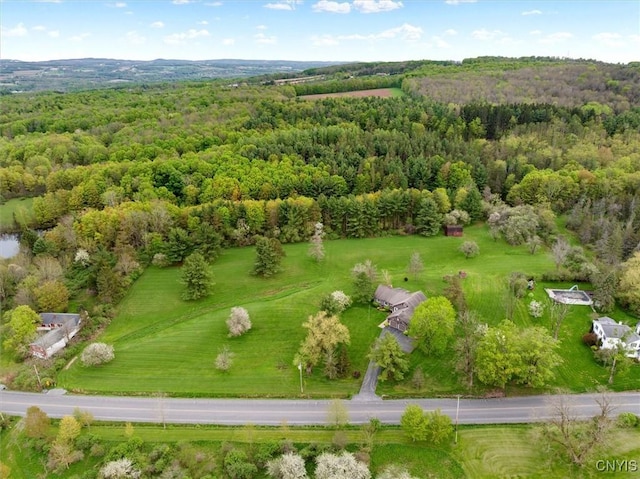 birds eye view of property with a wooded view