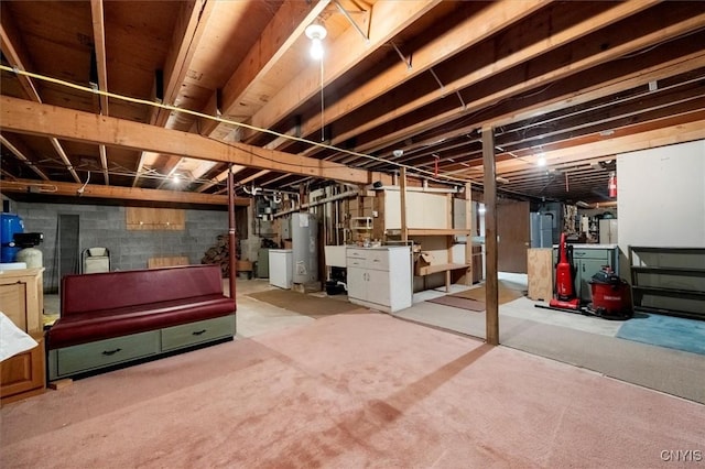 unfinished basement featuring water heater