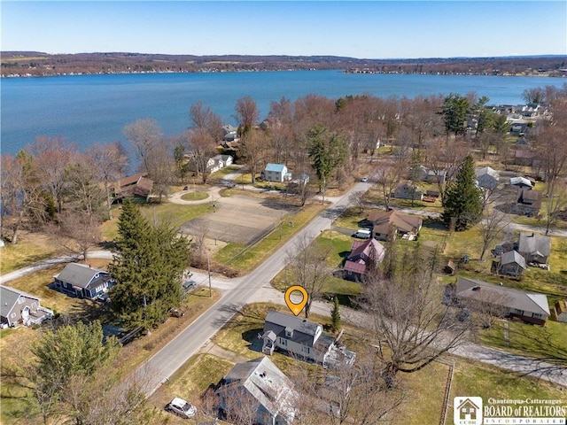 birds eye view of property with a water view