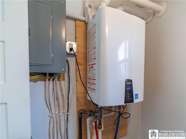 utilities featuring tankless water heater and electric panel