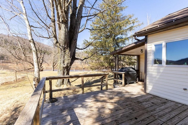 wooden deck featuring area for grilling