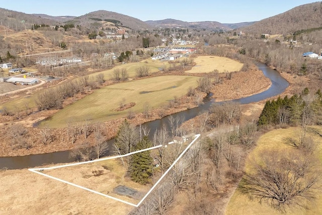 aerial view featuring a water and mountain view