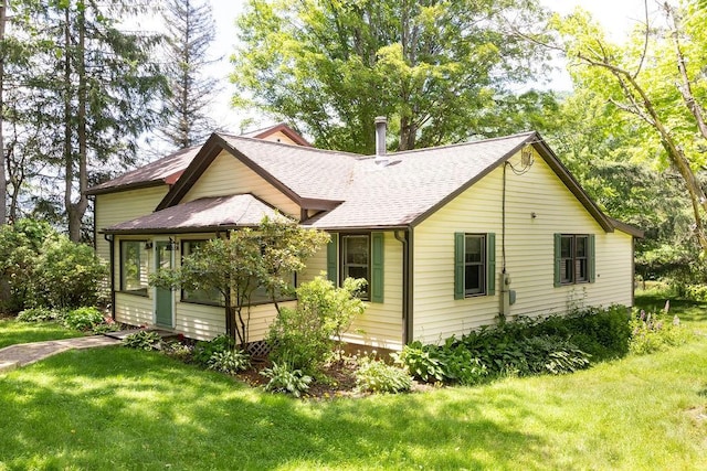 272 Arbor Hill Rd, Delhi, NY 13753 - view of side of property featuring roof with shingles, a yard, and a sunroom