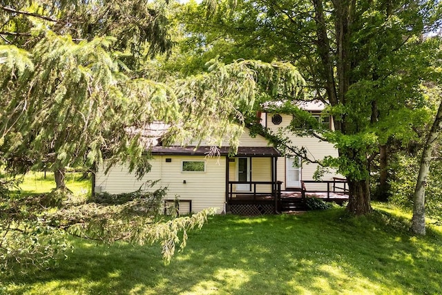 272 Arbor Hill Rd, Delhi, NY 13753 - back of house featuring a wooden deck, a yard, and a garage