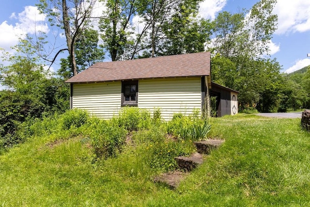 272 Arbor Hill Rd, Delhi, NY 13753 - view of property exterior featuring roof with shingles and a lawn