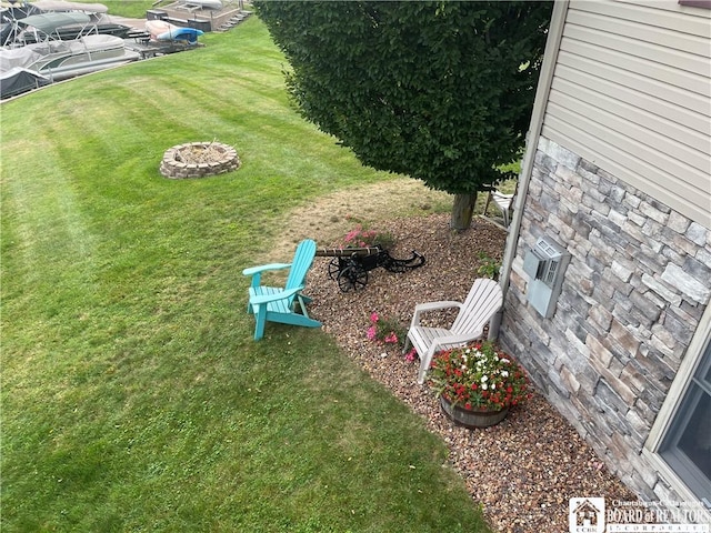 view of yard with a fire pit