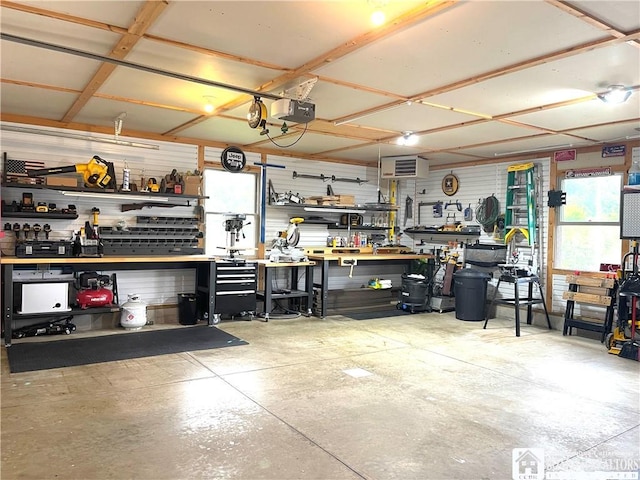 garage featuring a workshop area and a garage door opener