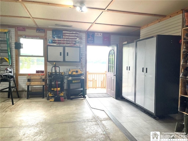 misc room featuring a garage and concrete flooring