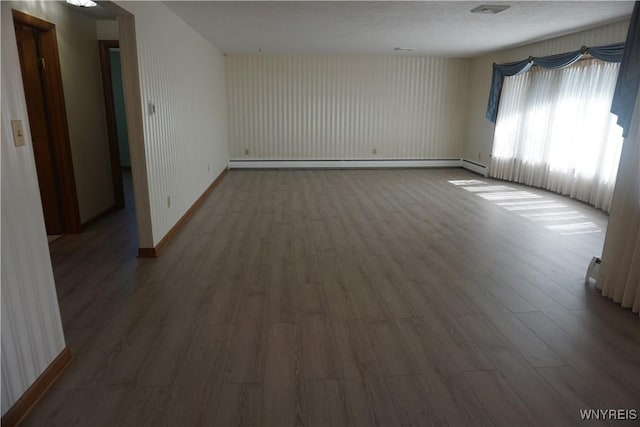 480 Lakeview Ave, Orchard Park, NY 14127 - spare room featuring wood finished floors, baseboards, and baseboard heating