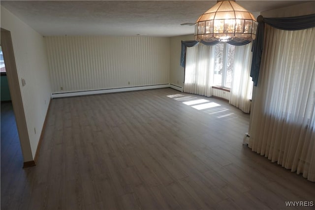480 Lakeview Ave, Orchard Park, NY 14127 - unfurnished room featuring a baseboard heating unit, wood finished floors, a chandelier, and baseboards