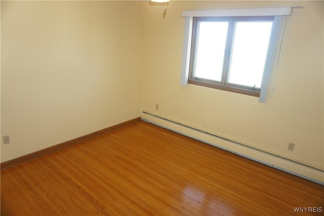 480 Lakeview Ave, Orchard Park, NY 14127 - unfurnished room featuring a baseboard heating unit, light wood-style flooring, and baseboards