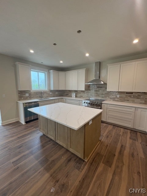 3515 Tall Tree Ln, Lysander, NY 13027 - kitchen featuring a center island, a sink, wall chimney exhaust hood, appliances with stainless steel finishes, and decorative backsplash