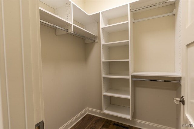 3515 Tall Tree Ln, Lysander, NY 13027 - walk in closet with dark wood-type flooring
