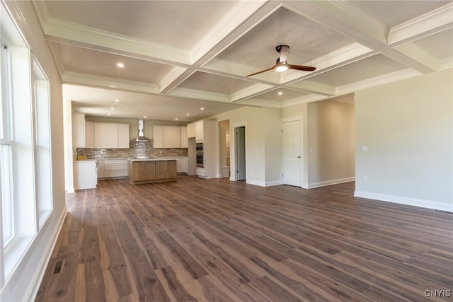 3515 Tall Tree Ln, Lysander, NY 13027 - unfurnished living room featuring dark wood-style floors, beam ceiling, a ceiling fan, coffered ceiling, and baseboards