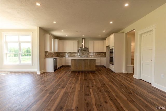 3515 Tall Tree Ln, Lysander, NY 13027 - kitchen featuring wall chimney exhaust hood, dark wood-style flooring, tasteful backsplash, stainless steel appliances, and a kitchen island