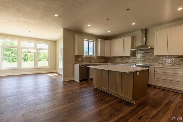 3515 Tall Tree Ln, Lysander, NY 13027 - kitchen featuring wall chimney range hood, appliances with stainless steel finishes, light countertops, decorative backsplash, and dark wood-style floors