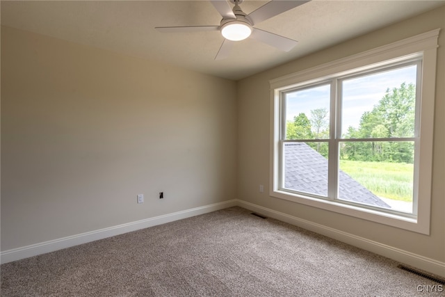 3515 Tall Tree Ln, Lysander, NY 13027 - unfurnished room with light colored carpet, baseboards, and a ceiling fan