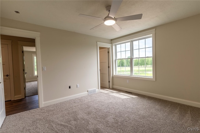 3515 Tall Tree Ln, Lysander, NY 13027 - unfurnished bedroom with carpet flooring, baseboards, and a ceiling fan