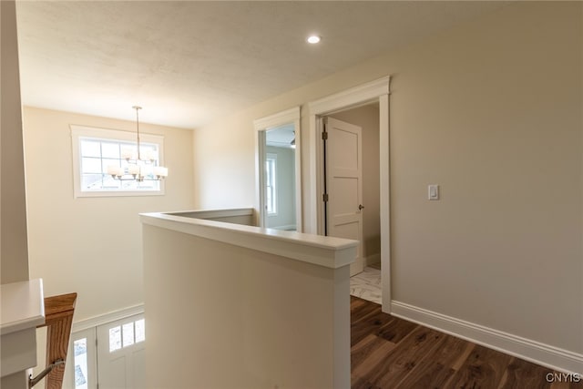 3515 Tall Tree Ln, Lysander, NY 13027 - hall featuring dark wood-type flooring, a chandelier, healthy amount of natural light, baseboards, and recessed lighting