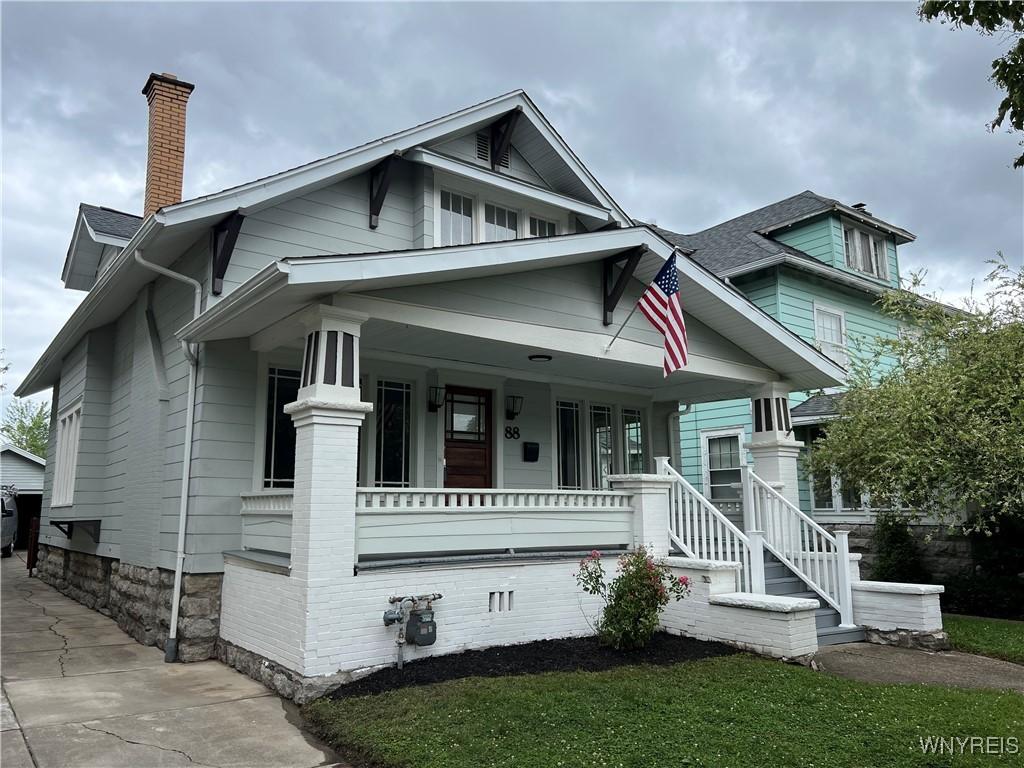 88 Wellington Rd, Buffalo, NY 14216 - bungalow-style house featuring covered porch and a chimney
