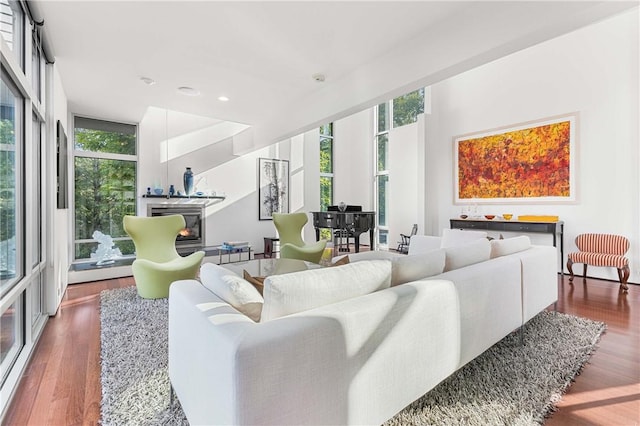 10289-10288 Whispering Wind Trl, Corning, NY 14830 - living room featuring healthy amount of natural light, wood finished floors, a fireplace, and recessed lighting
