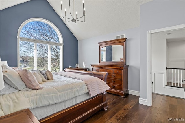 4369 Autumn Ln, Lewiston, NY 14092 - bedroom with high vaulted ceiling, visible vents, baseboards, a notable chandelier, and wood-type flooring