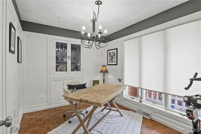 4369 Autumn Ln, Lewiston, NY 14092 - home office with visible vents and an inviting chandelier