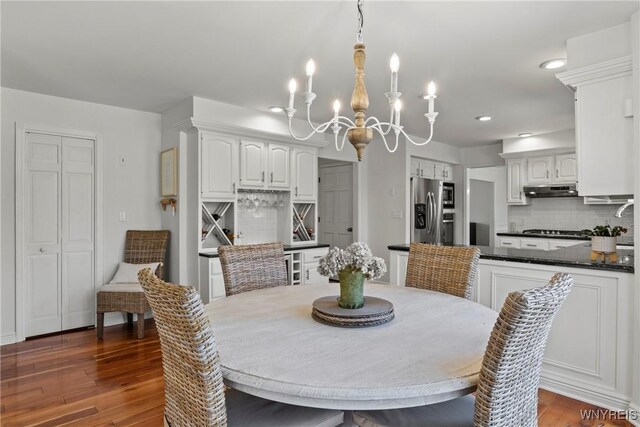 4369 Autumn Ln, Lewiston, NY 14092 - dining space featuring wood finished floors and a chandelier