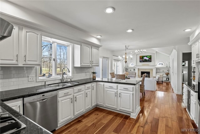 4369 Autumn Ln, Lewiston, NY 14092 - kitchen featuring a notable chandelier, white cabinetry, a peninsula, stainless steel dishwasher, and open floor plan