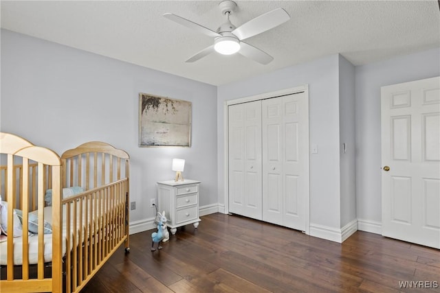 4369 Autumn Ln, Lewiston, NY 14092 - bedroom with baseboards, a closet, wood finished floors, and a textured ceiling