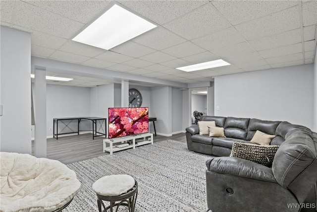 4369 Autumn Ln, Lewiston, NY 14092 - living area featuring a paneled ceiling, baseboards, and wood finished floors