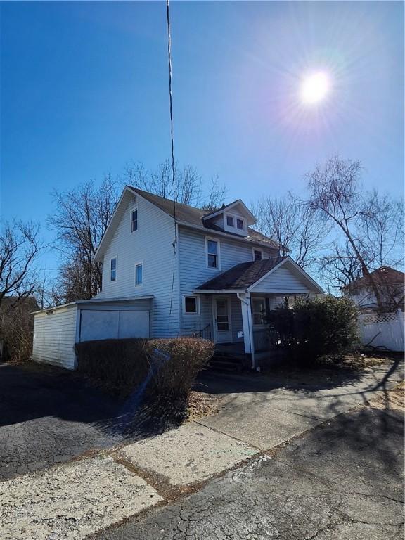 404 Schuyler Ave, Elmira-City, NY 14901 - view of front facade with driveway and a garage