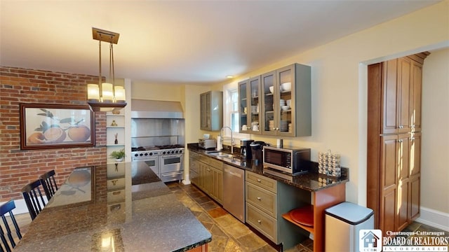 kitchen with a sink, wall chimney range hood, open shelves, and stainless steel appliances