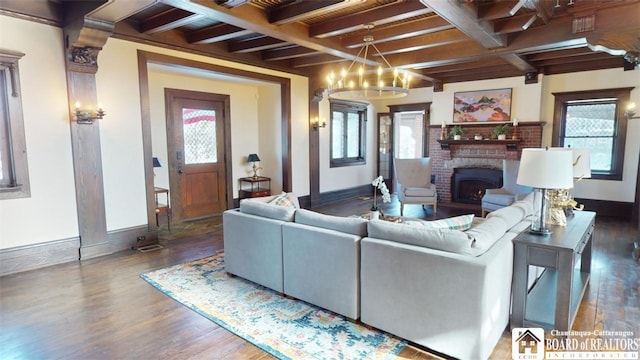 living area with baseboards, wood finished floors, and beamed ceiling