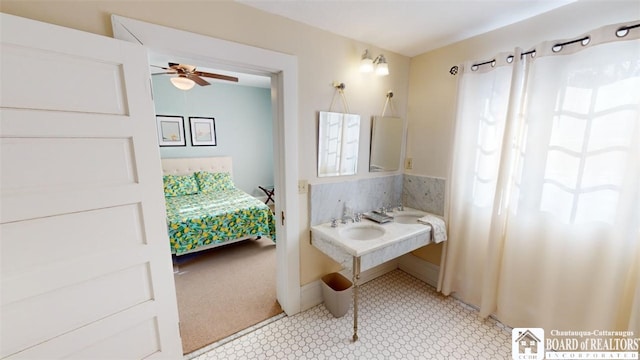 bathroom featuring a sink and ceiling fan