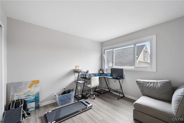office with baseboards and wood finished floors