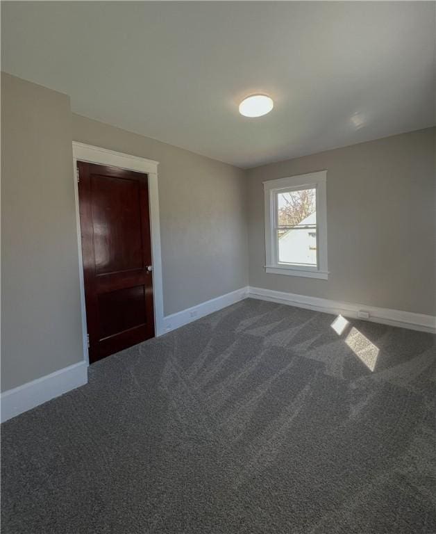 1230 Lake St, Elmira-City, NY 14901 - spare room with baseboards and dark carpet