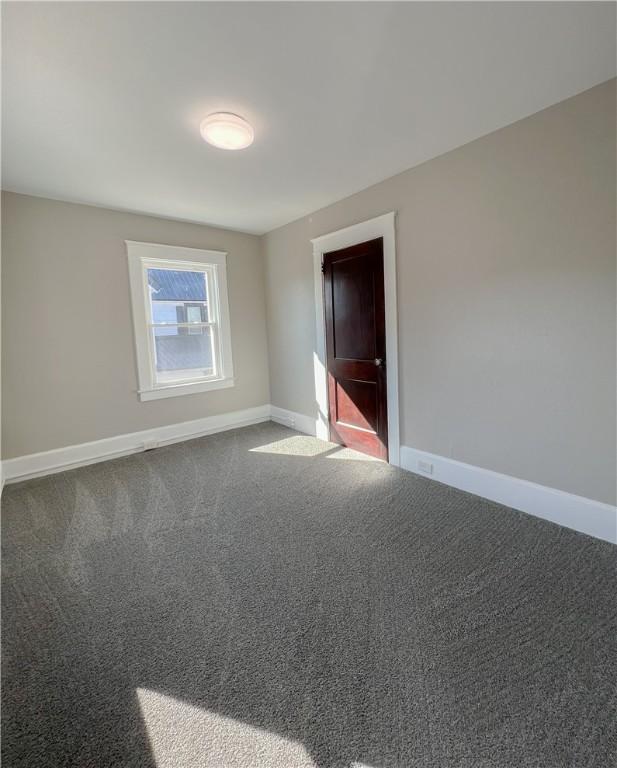 1230 Lake St, Elmira-City, NY 14901 - carpeted empty room featuring baseboards