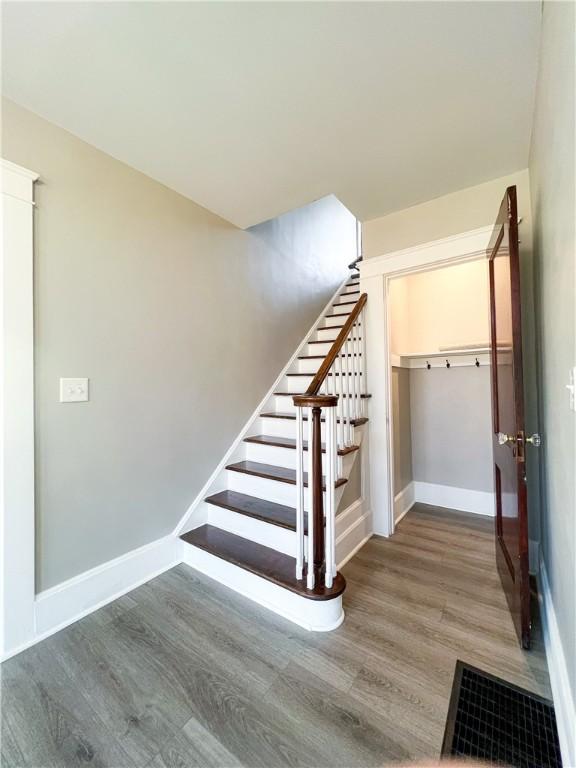 1230 Lake St, Elmira-City, NY 14901 - stairway with baseboards and wood finished floors