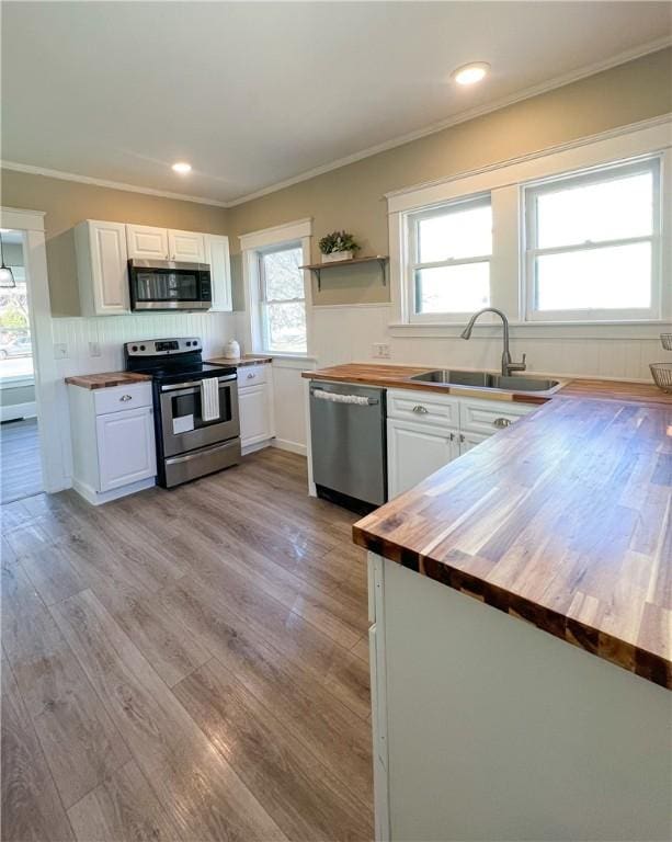 1230 Lake St, Elmira-City, NY 14901 - kitchen featuring wooden counters, a sink, stainless steel appliances, and light wood-style floors