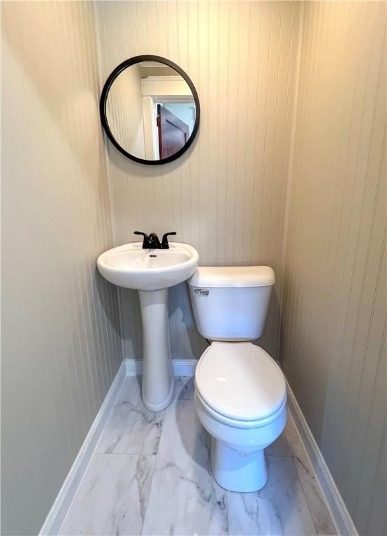 1230 Lake St, Elmira-City, NY 14901 - bathroom with baseboards, marble finish floor, toilet, and a sink