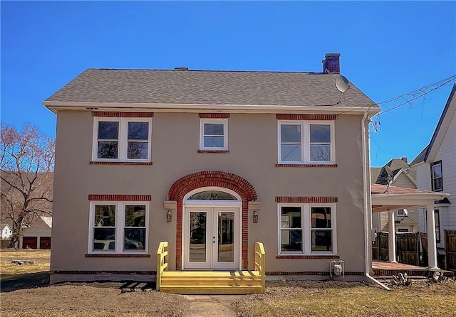 1230 Lake St, Elmira-City, NY 14901 - rear view of property with french doors, stucco siding, roof with shingles, and a chimney