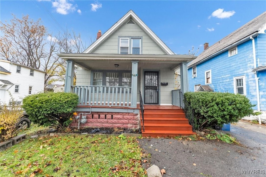 218 Hutchinson Ave, Buffalo, NY 14215 - view of front of house with a chimney and covered porch