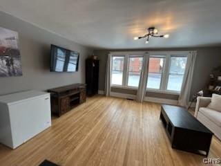 140 Riverside Dr, Utica, NY 13502 - living area with light wood-style flooring