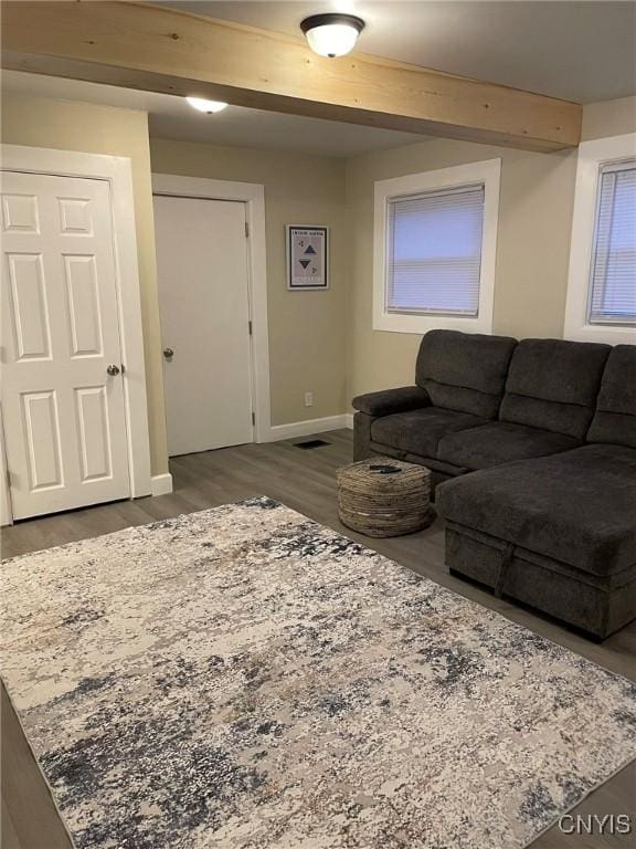 140 Riverside Dr, Utica, NY 13502 - living area with visible vents, beam ceiling, baseboards, and dark wood-type flooring