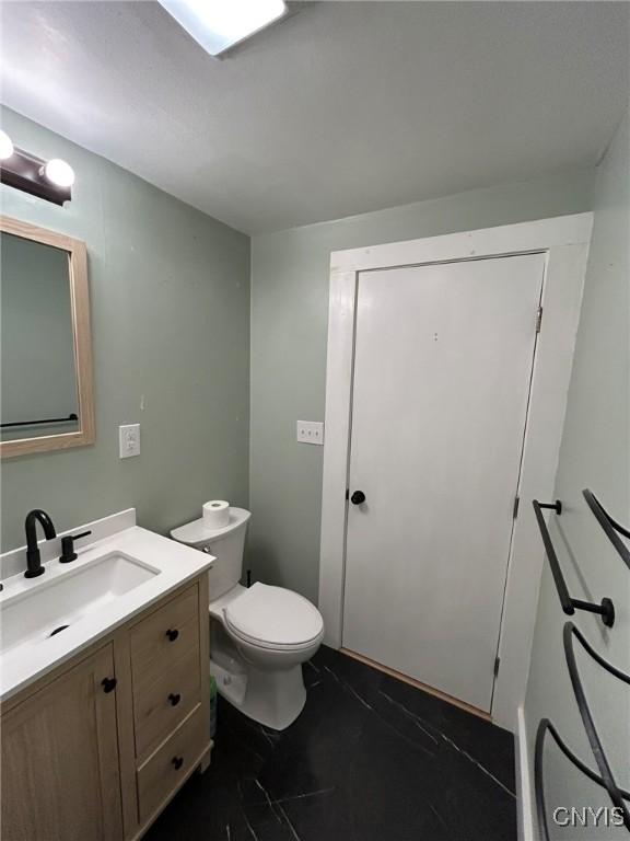 140 Riverside Dr, Utica, NY 13502 - bathroom with vanity and toilet