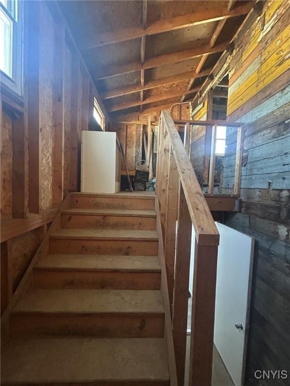 140 Riverside Dr, Utica, NY 13502 - staircase with wood walls and plenty of natural light