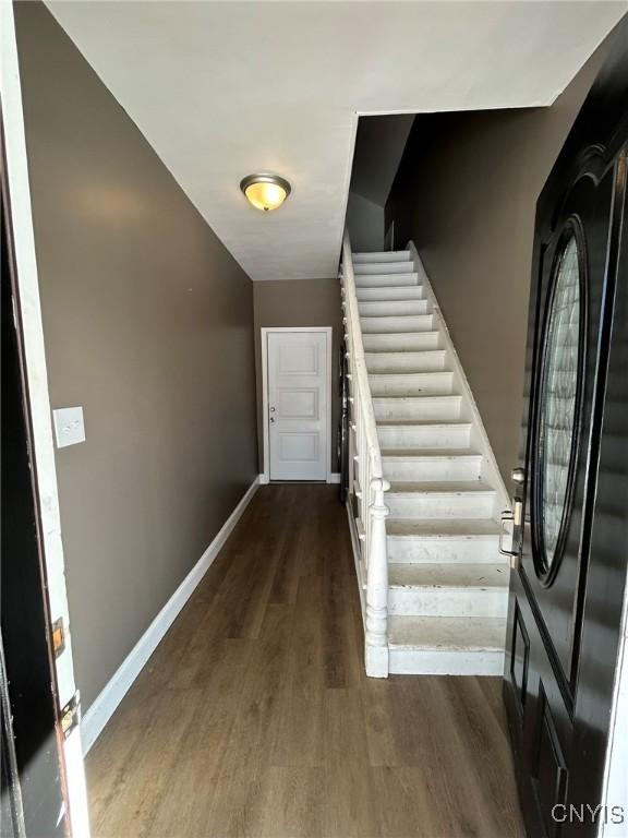 140 Riverside Dr, Utica, NY 13502 - entryway with dark wood finished floors and stairs