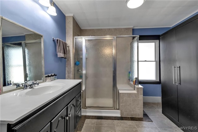 bathroom with a shower stall, ornamental molding, and tile patterned flooring