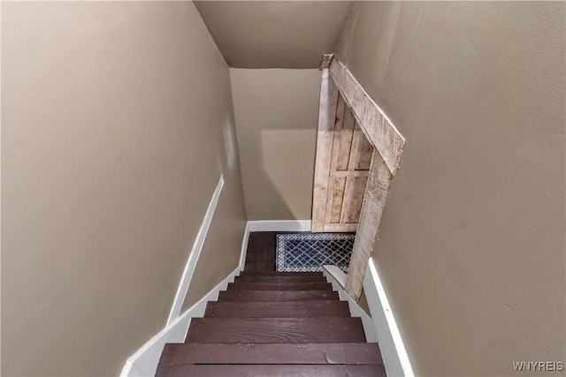 stairs with baseboards and visible vents
